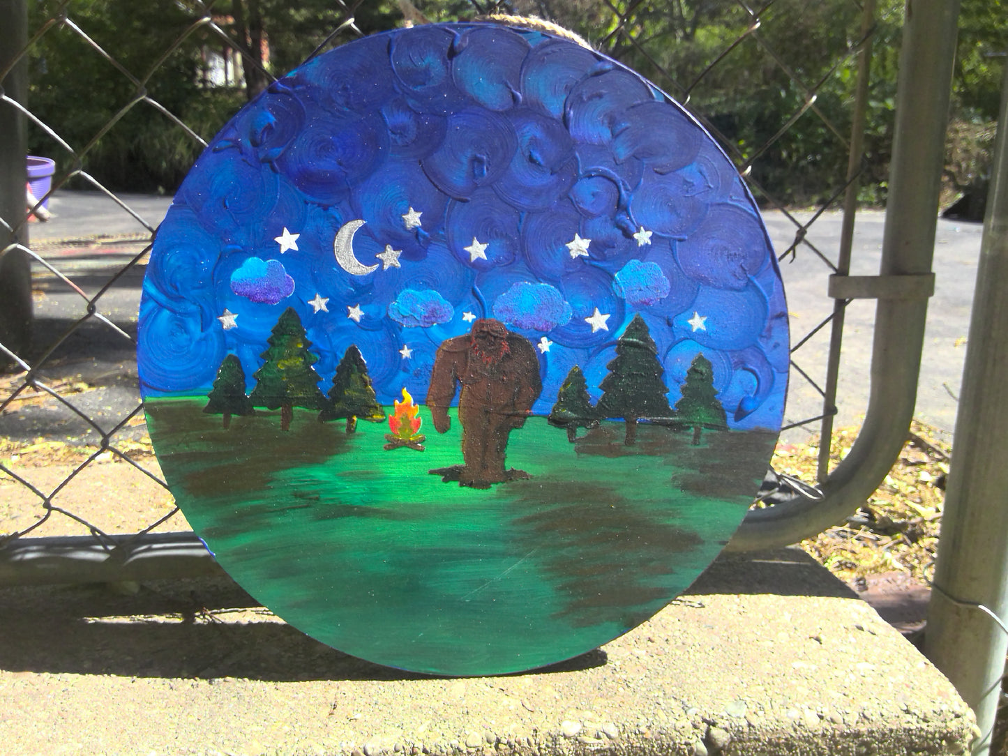 bigfoot painting with campfire