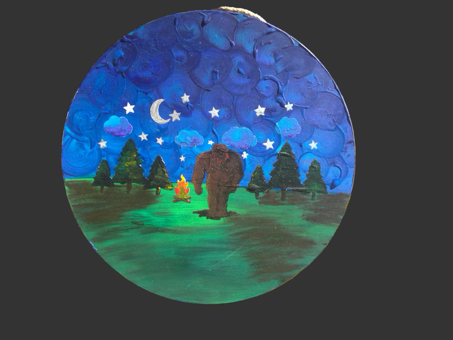 bigfoot painting with campfire