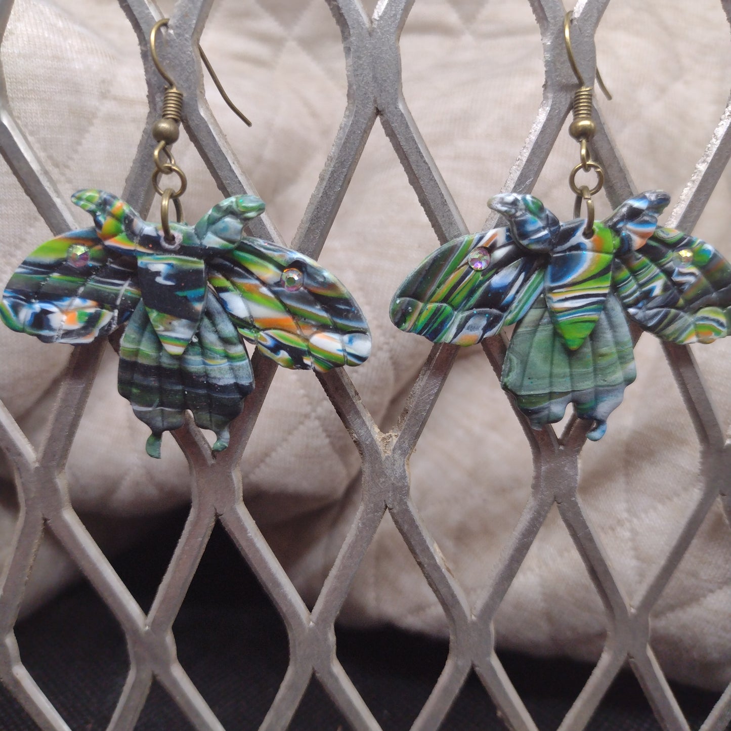 Camouflage moths with rhinestones