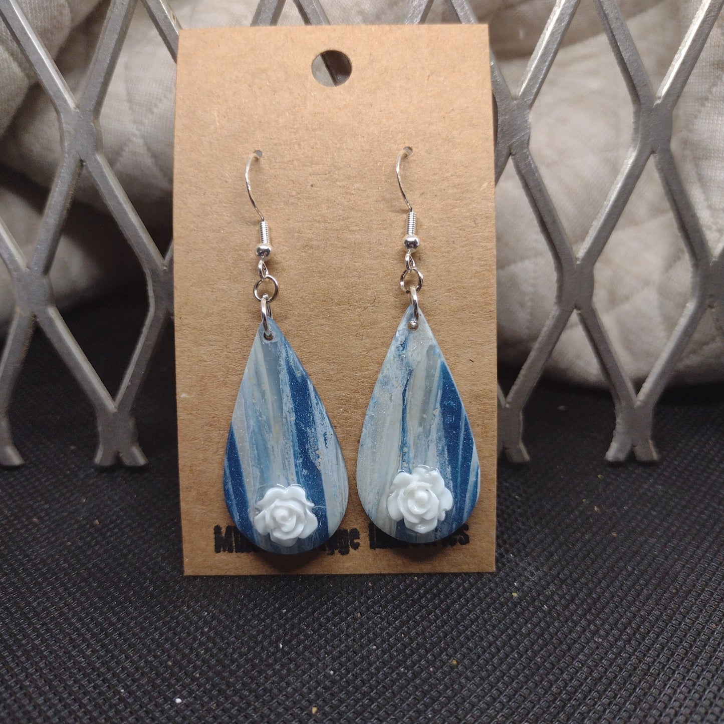 Blue and sparkling swirls with white roses