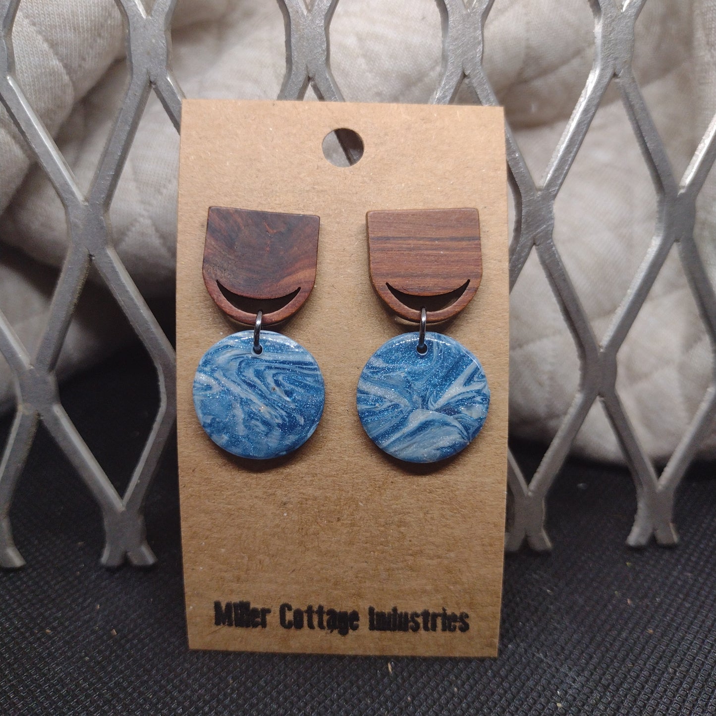 Blue and sparkling swirls with wood studs