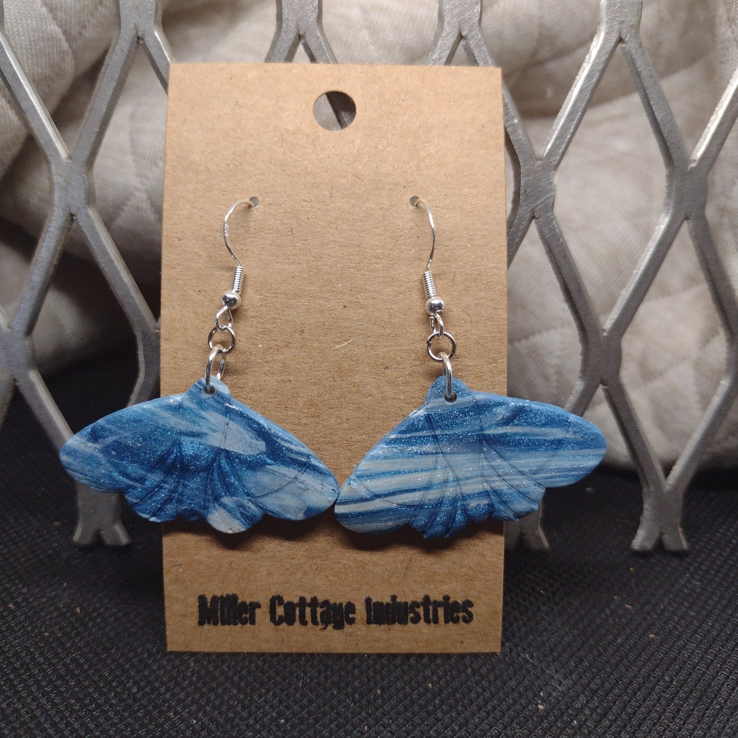 Blue and sparkling swirls moth