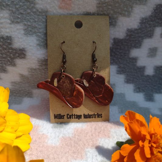 Cowboy hat with copper feather