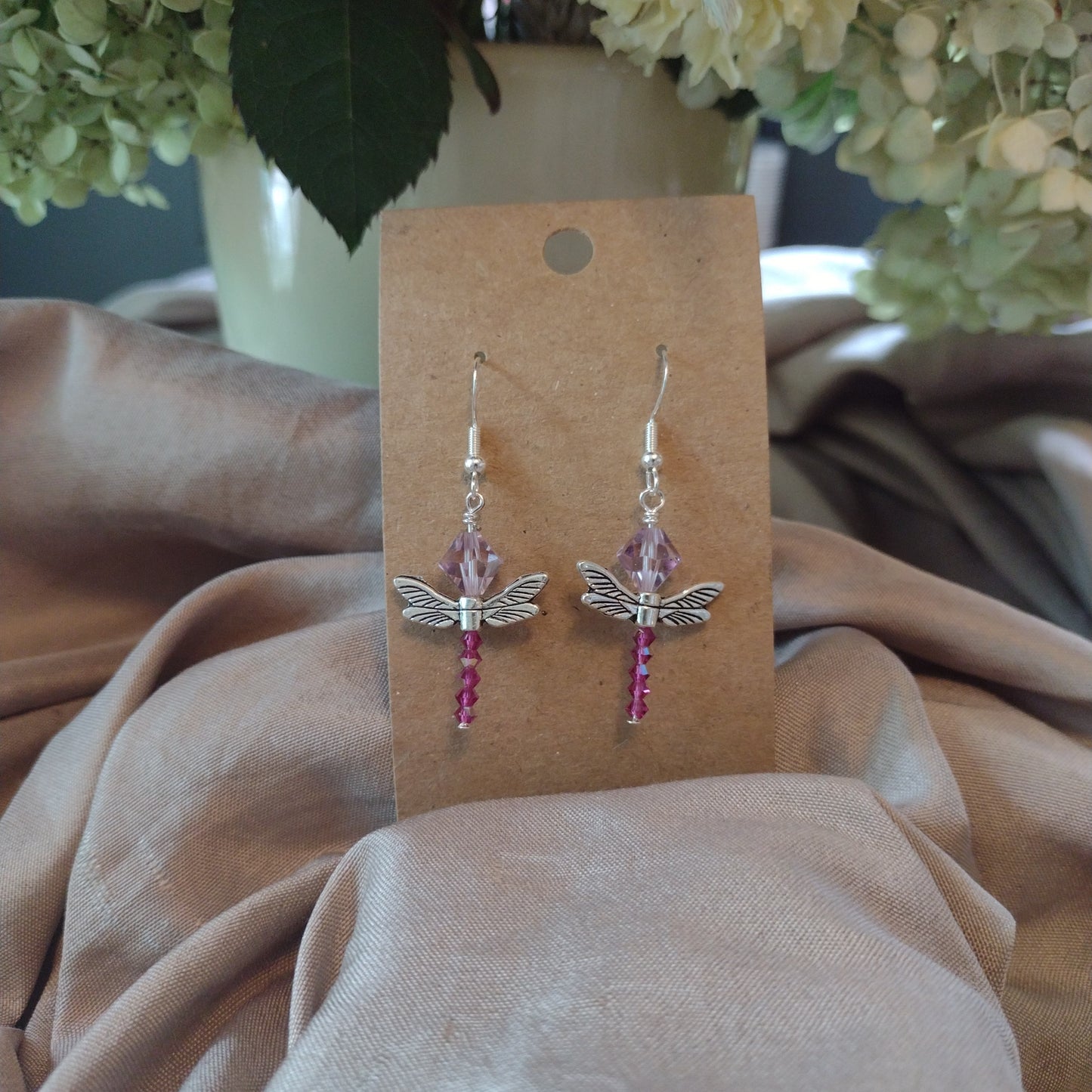 Pink and maroon dragonflies