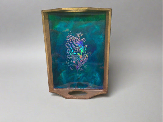 small gold tray with feather