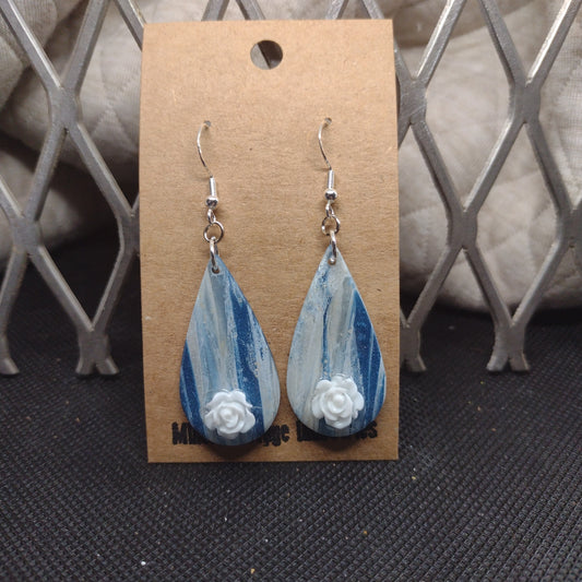 Blue and sparkling swirls with white roses