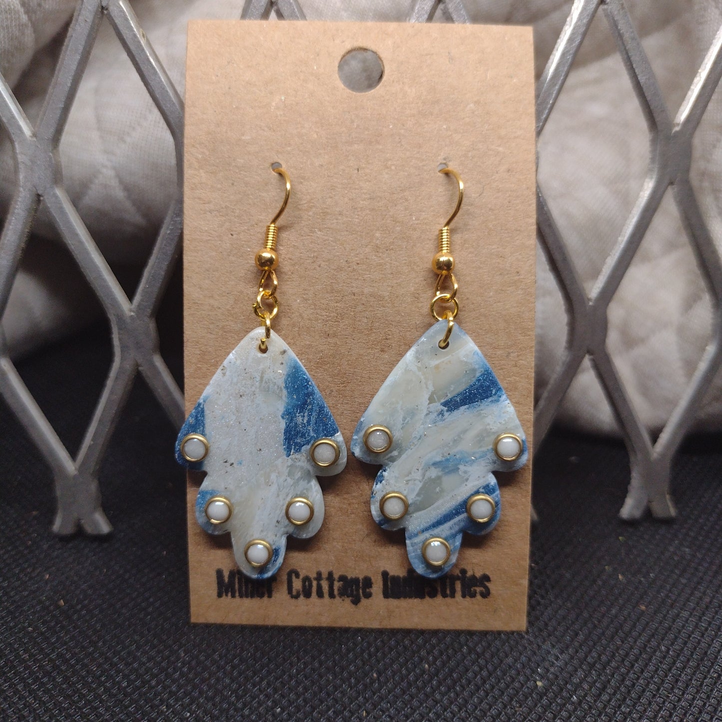 Blue and sparkling swirls with white adornments