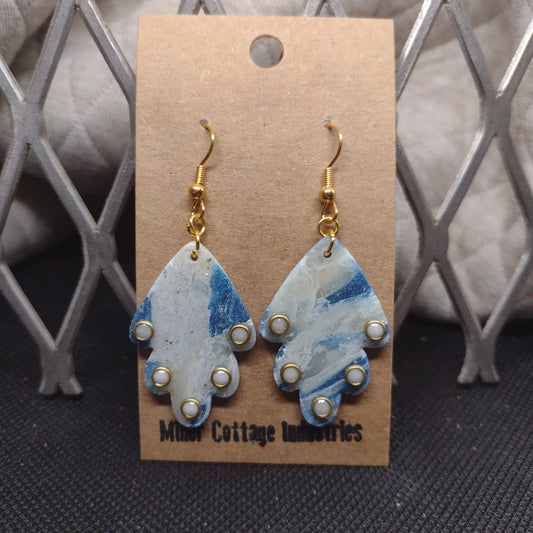 Blue and sparkling swirls with white adornments