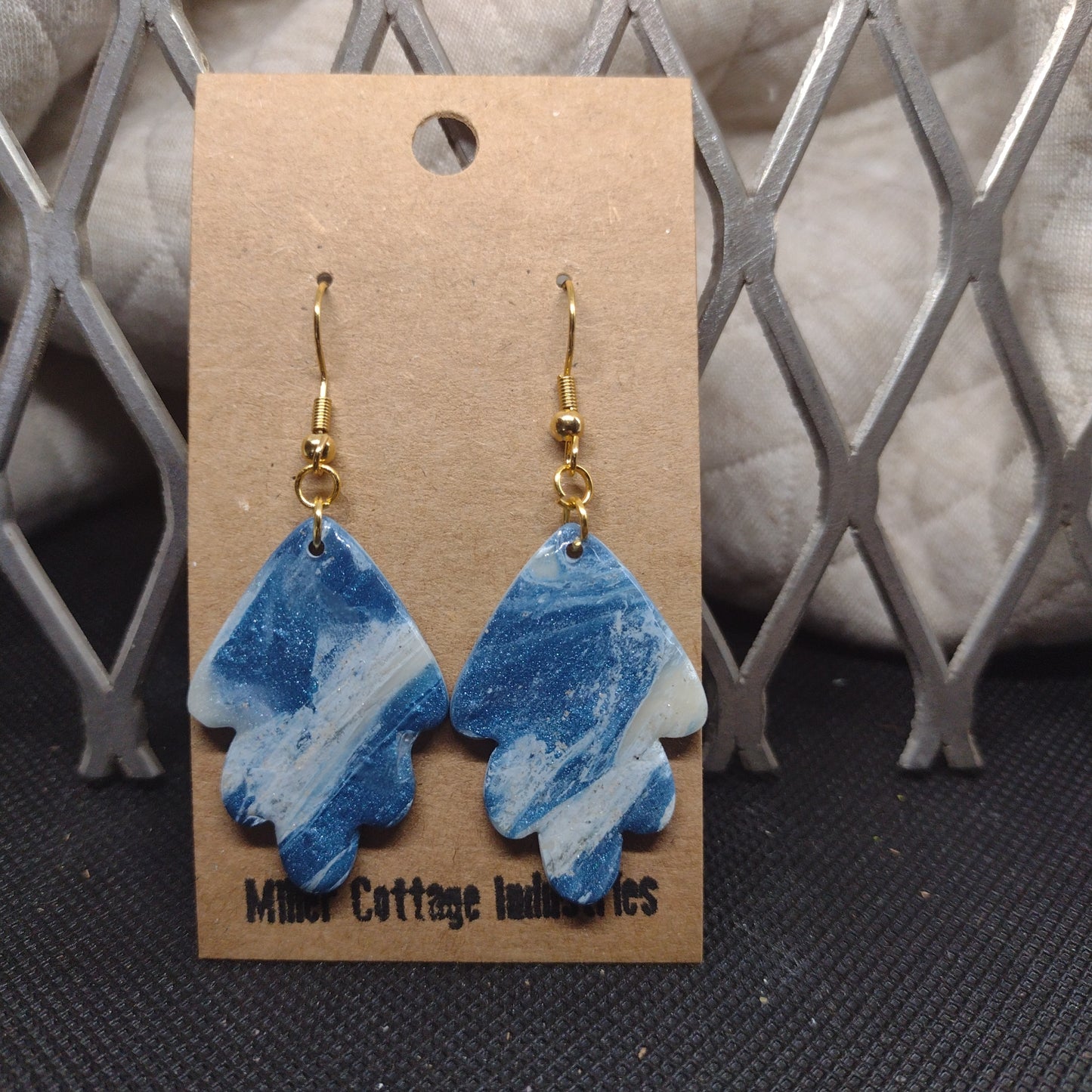 Blue and sparkling swirls in gold