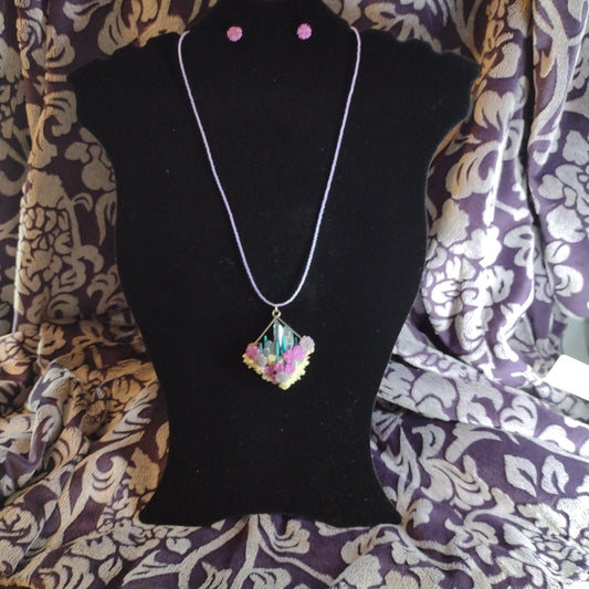 Crystals and glow-in-the-dark pendant on purple seed bead necklace. Matching stud earrings
