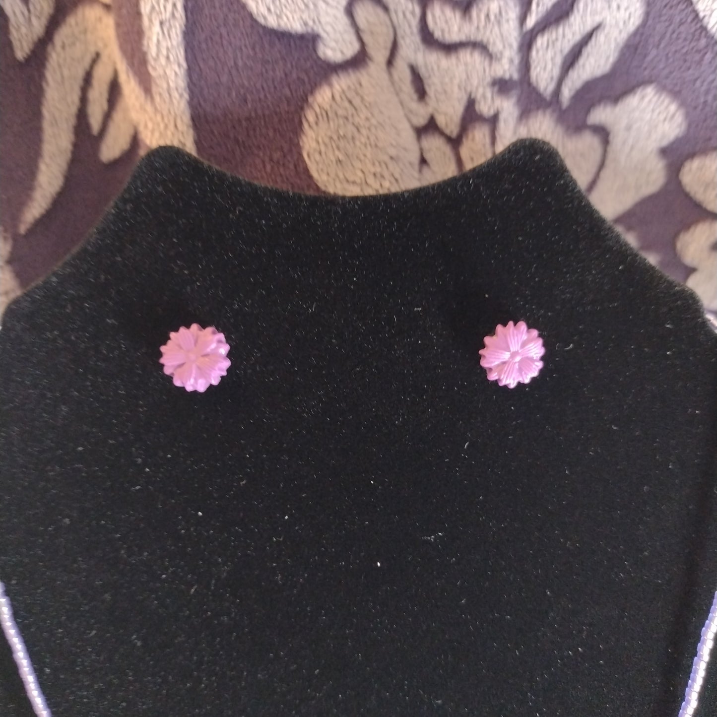 Crystals and glow-in-the-dark pendant on purple seed bead necklace. Matching stud earrings