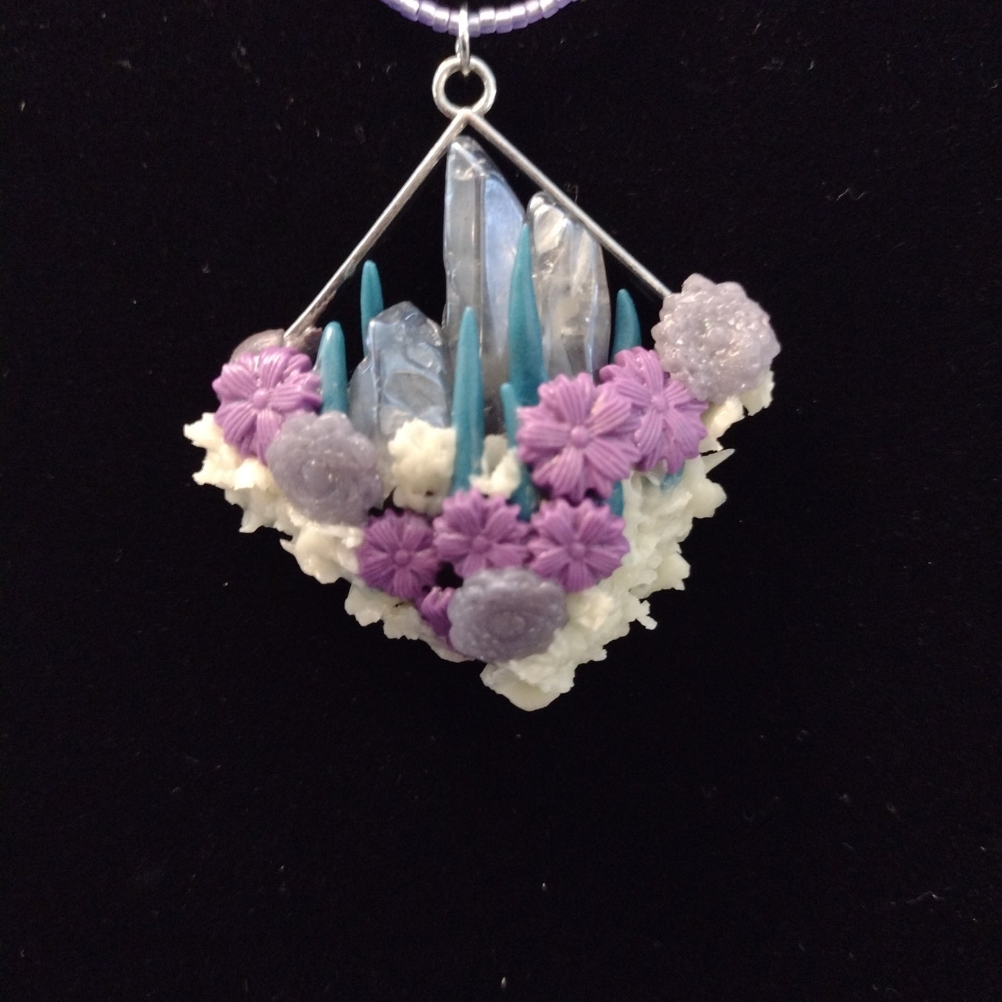 Crystals and glow-in-the-dark pendant on purple seed bead necklace. Matching stud earrings