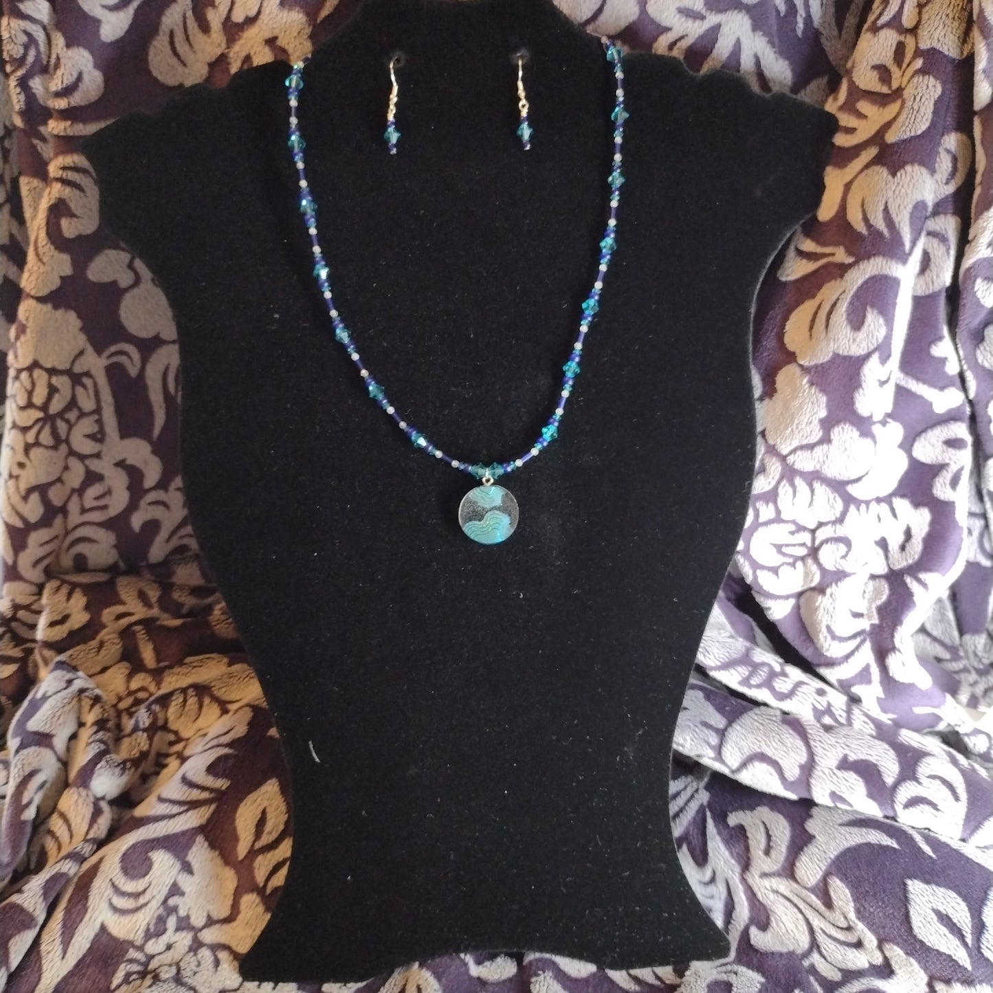 Green and blue topography necklace set