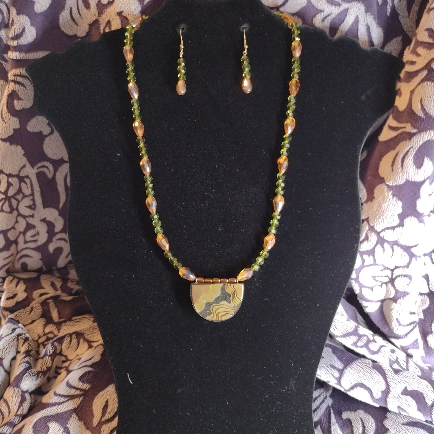 Green and brown topography necklace set
