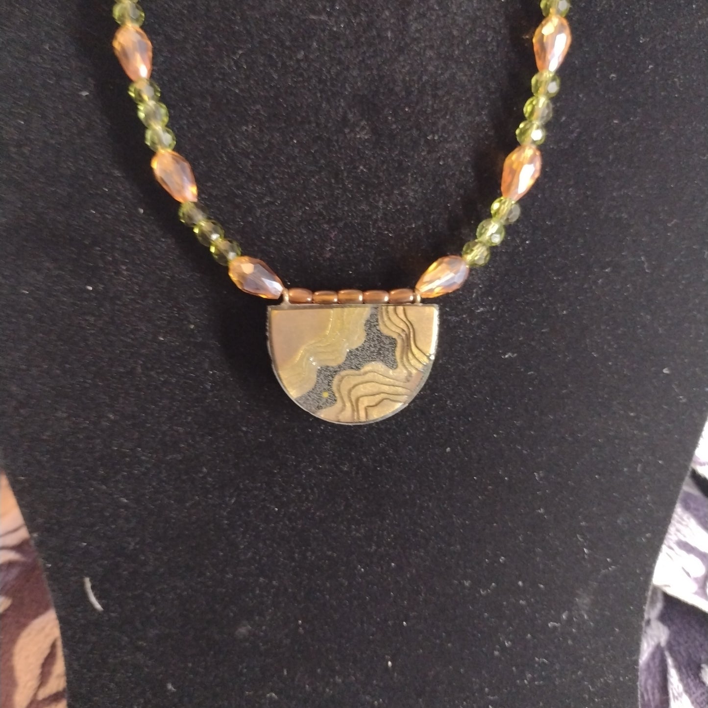 Green and brown topography necklace set