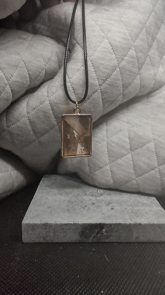 Brown, gold, and white square pendant